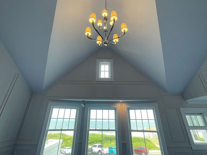 chandelier installation, Experienced electrician tracing an urgent wiring fault with advanced diagnostic testing tools